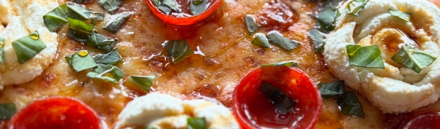 Margherita pizza with cherry tomatoes and basil